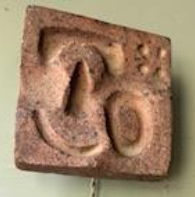 Terracotta wall sconce  George Jouve tiles on steel brackets. Single edison bulb. Color variances in the clay. Intended to be plug-in. Sold Seperately